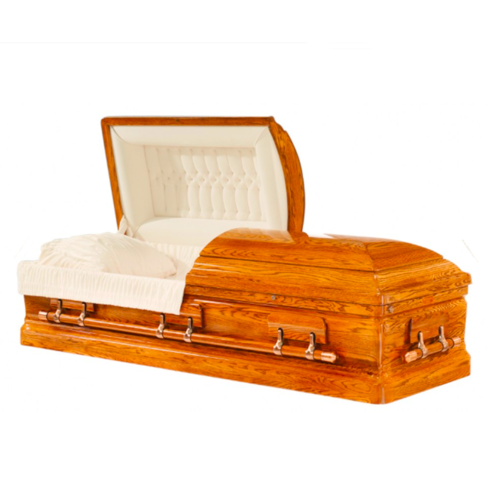 A polished Oak coffin with an open lid, featuring white upholstered interior and a soft pillow.